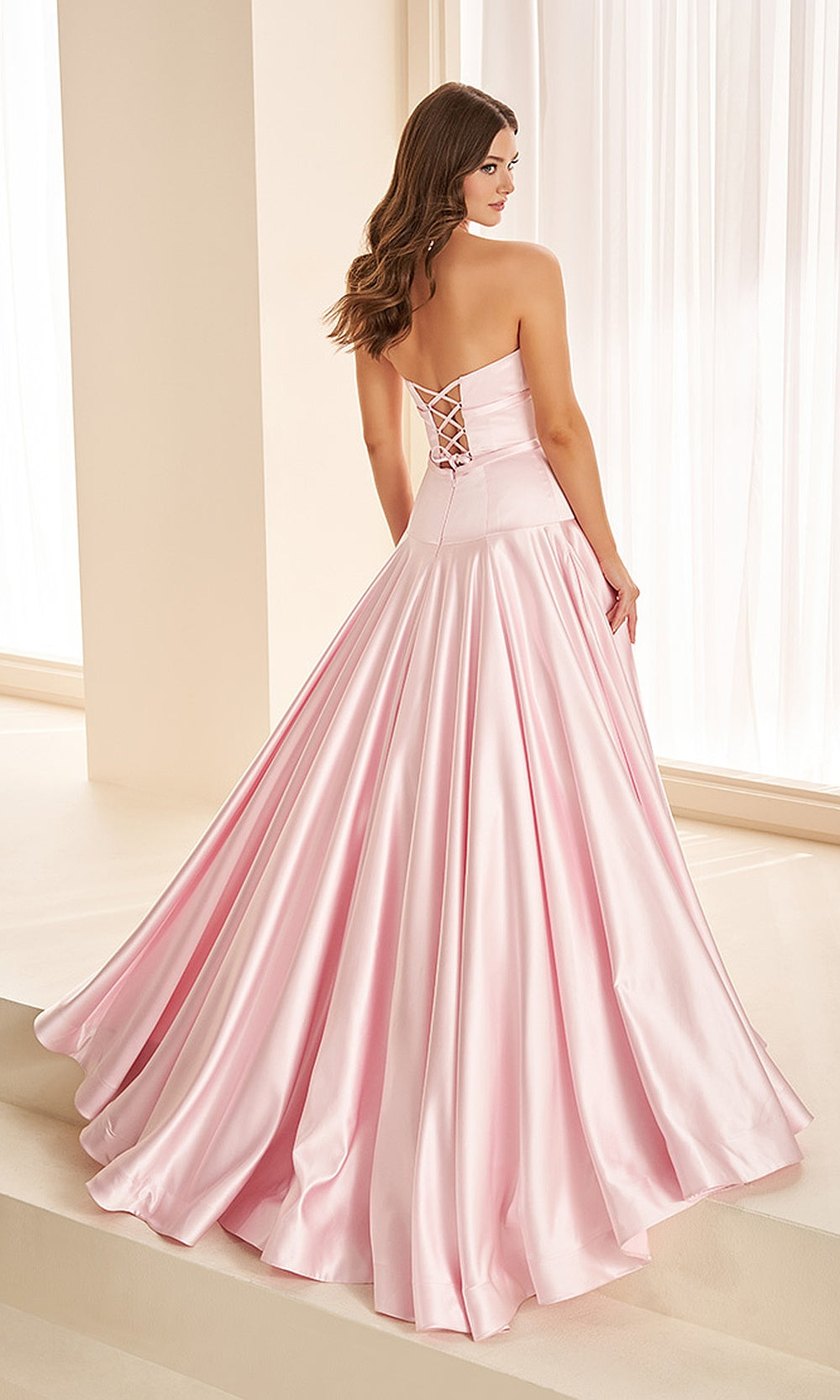 Ellie Wilde EW38080 Sakura Pink prom dress with satin fabric, crisscross lace-up corset back, full ballgown skirt with sweep train, back view, sweet 16 ball gown