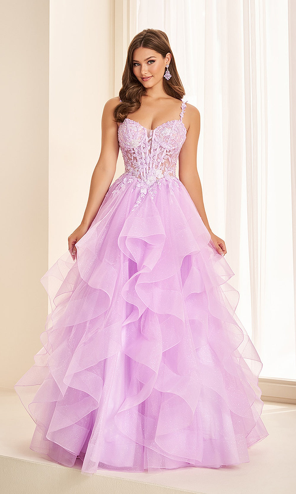 Ellie Wilde EW38123 Lilac prom dress front view with glitter tulle, lace floral appliqués, sweetheart neckline, ruffled ballgown silhouette, stunning gala gown.