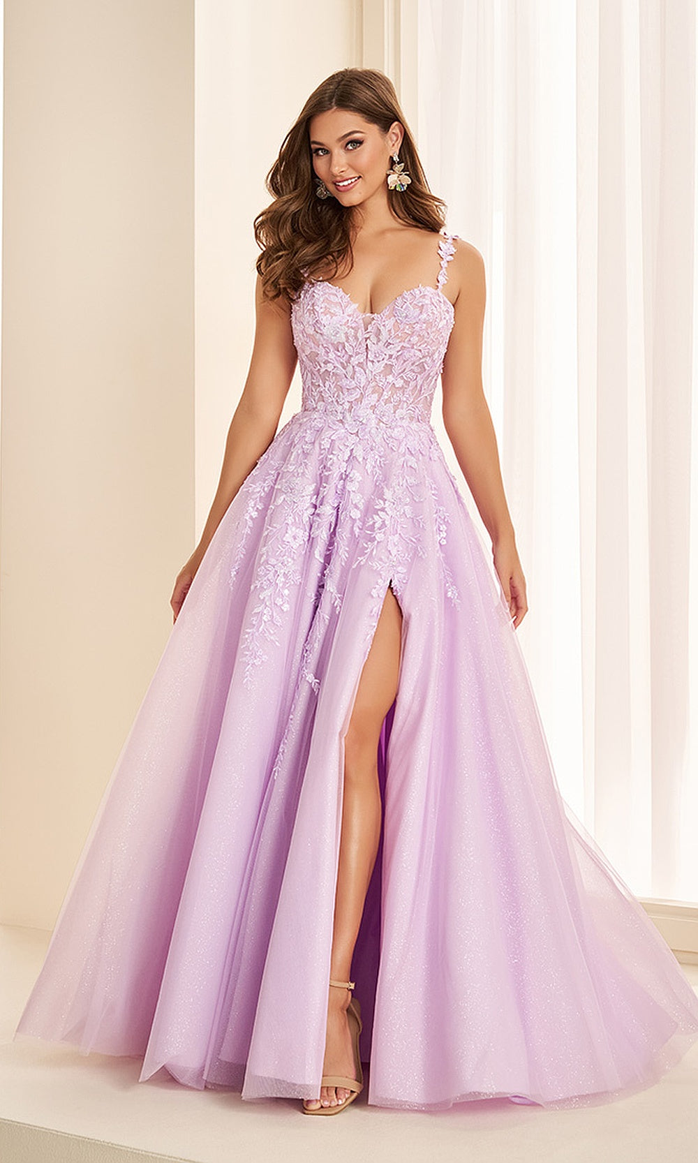 Ellie Wilde EW38124 Lilac prom dress front view with glitter tulle, embroidery and floral appliques, sweetheart neckline, A-line ballgown silhouette, black tie event dress.