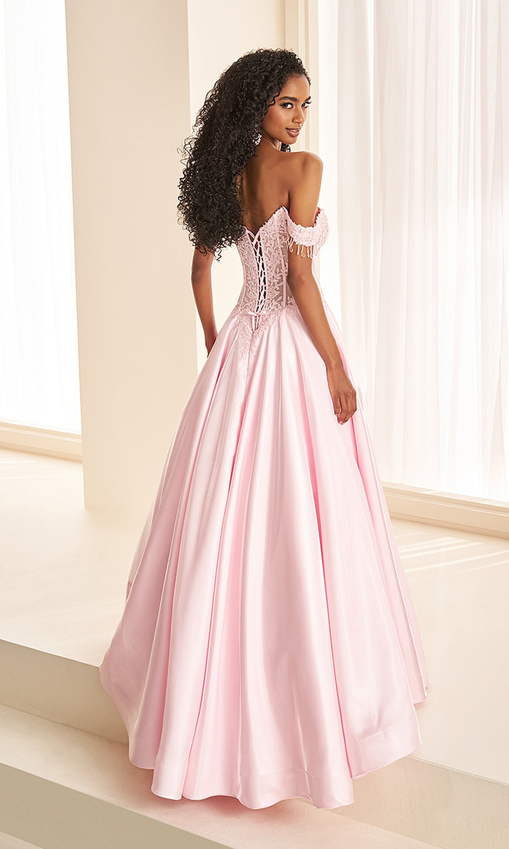 Ellie Wilde EW38128 Light Pink off-shoulder prom dress back view with lace and satin, corset back and boning, ballgown silhouette, pageant-ready gown.