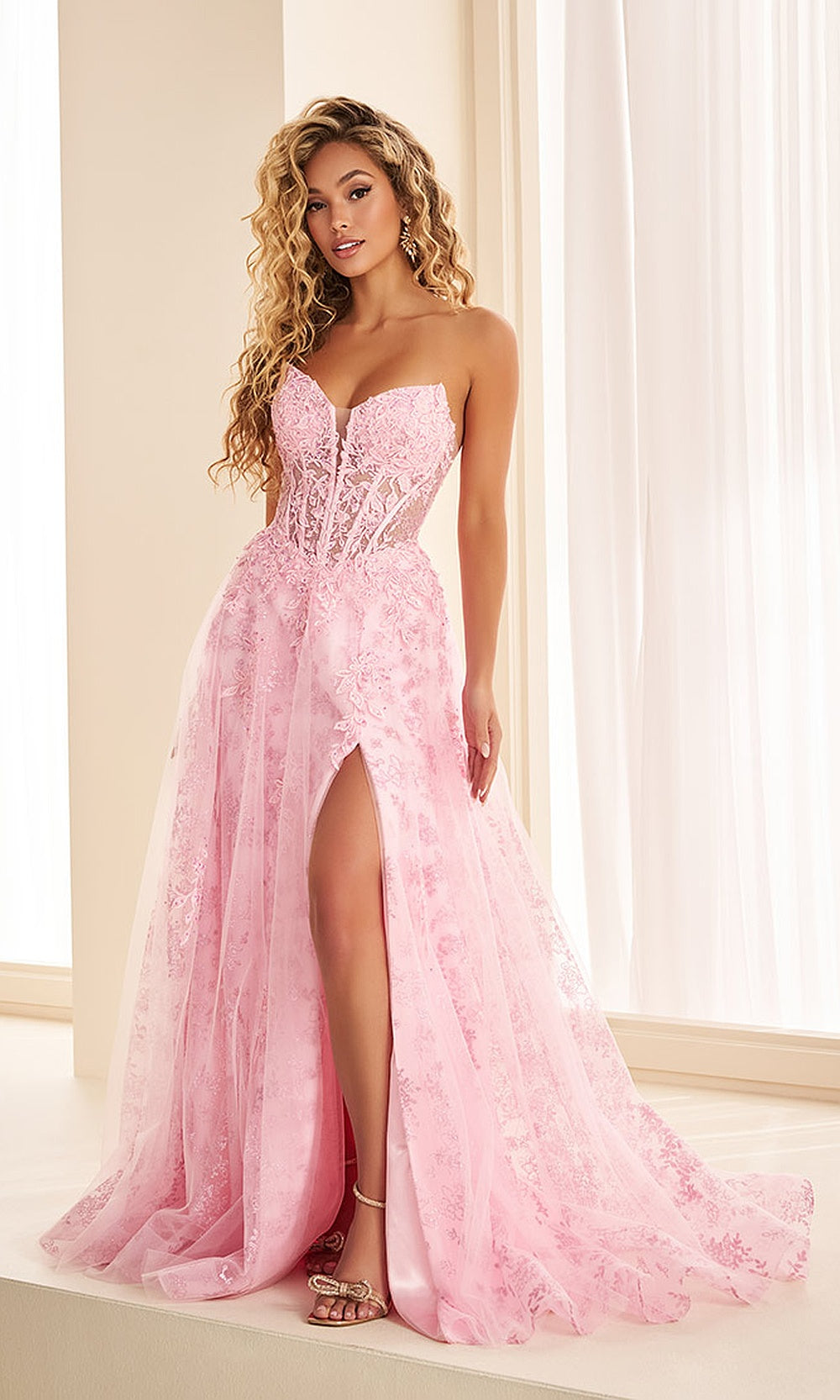 Ellie Wilde EW38131 Light Pink prom dress front view with tulle and lace, floral appliques, sweetheart strapless ballgown silhouette, formal prom gown.