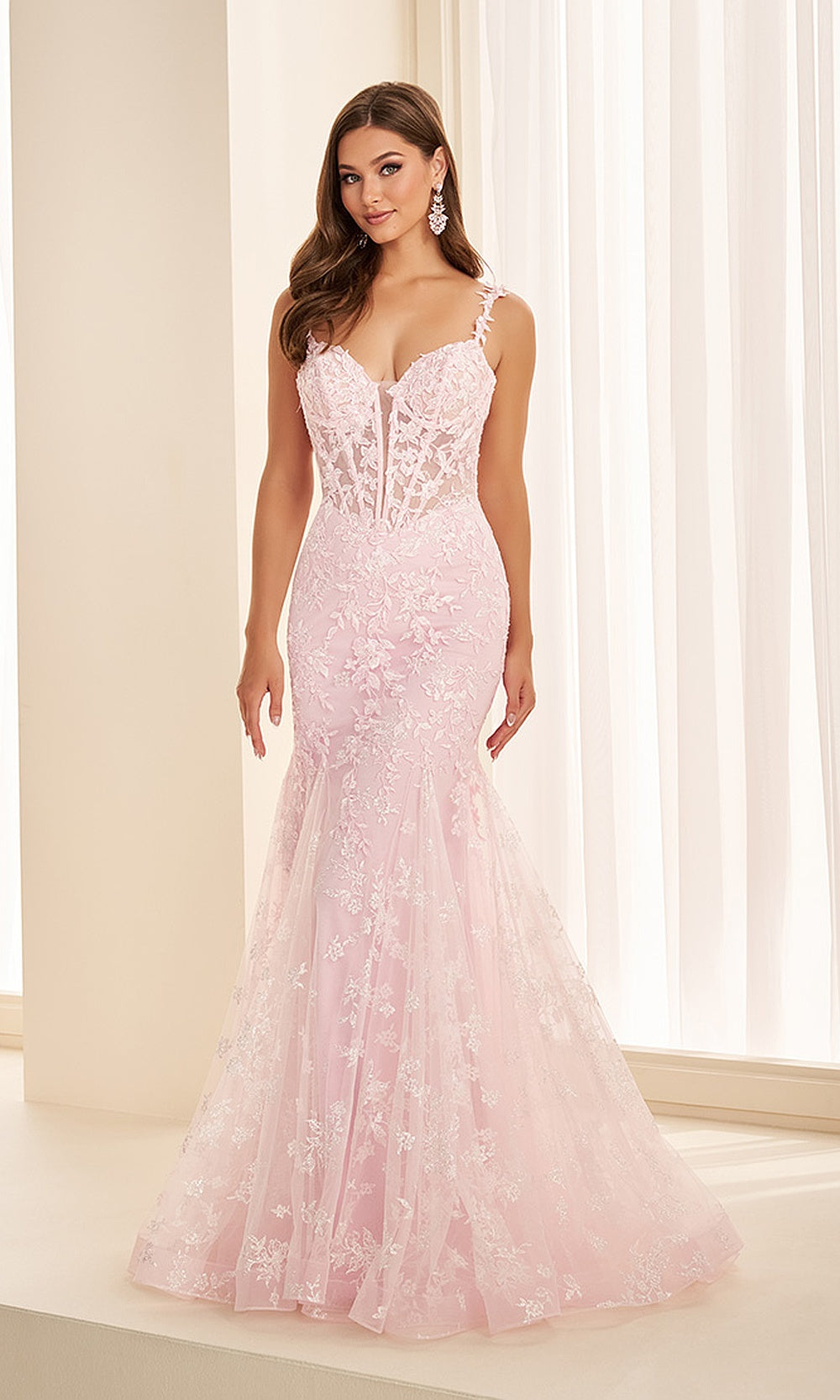 Ellie Wilde EW38138 Ice Pink prom dress front view with glitter lace and mesh, floral appliques and boned corset bodice, mermaid silhouette, pageant-ready gown.