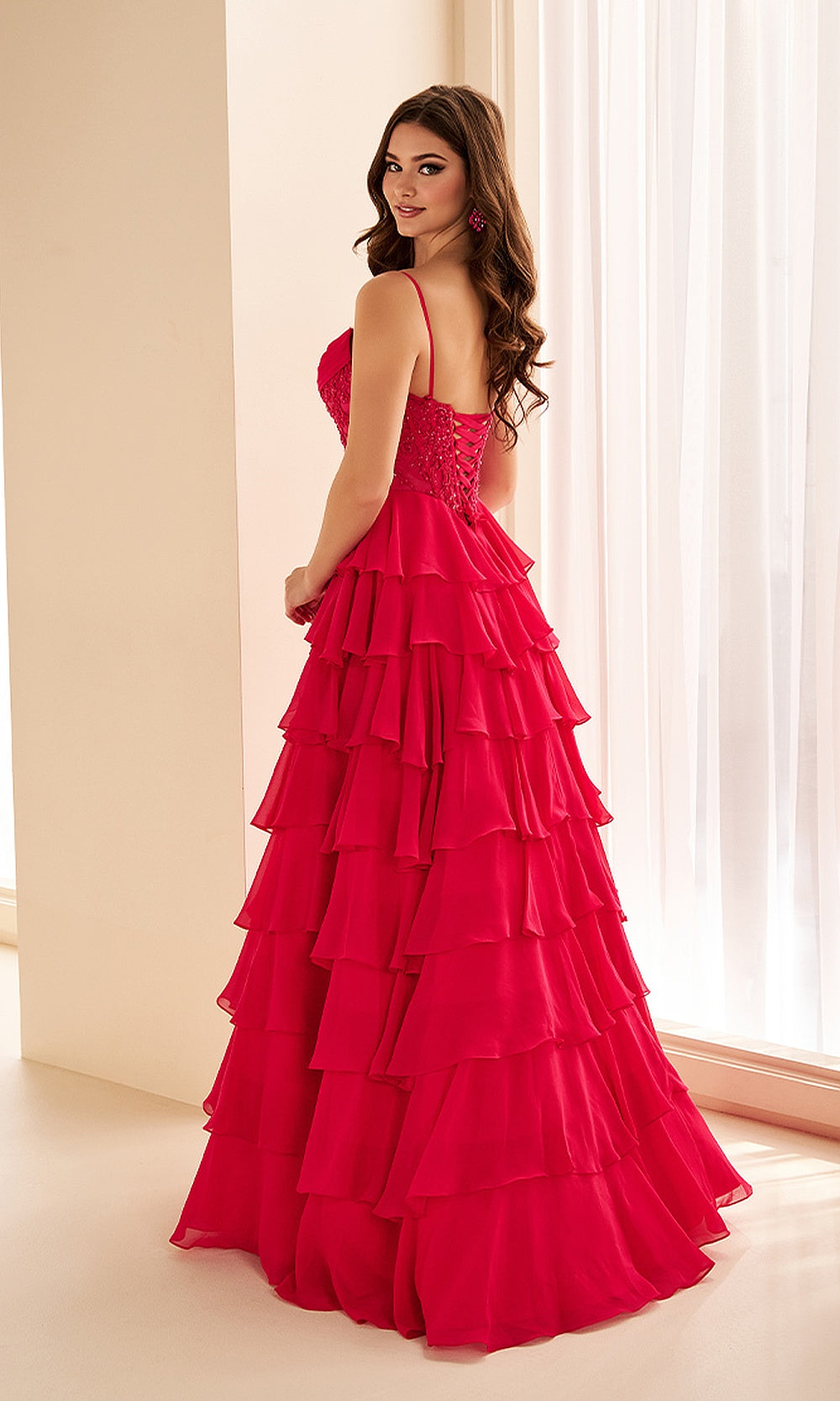 Ellie Wilde EW38201 Magenta prom dress back view with chiffon, lace-up corset back, ruffle skirt with high slit, evening gown.