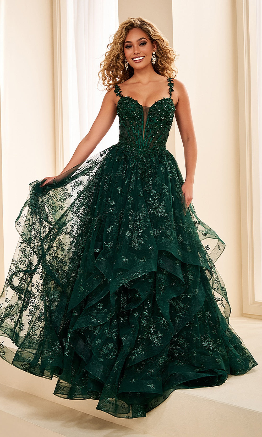 Ellie Wilde EW38204 Emerald prom dress front view with glitter tulle and lace, beaded floral appliques, sweetheart corset bodice, and dramatic ruffle ballgown skirt, formal prom gown.