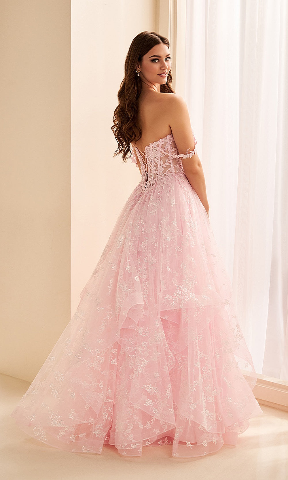 Ellie Wilde EW38204 Light Pink prom dress back view with tulle and lace, corset lace-up back, boning detail, and full ruffle ballgown silhouette, evening gown.