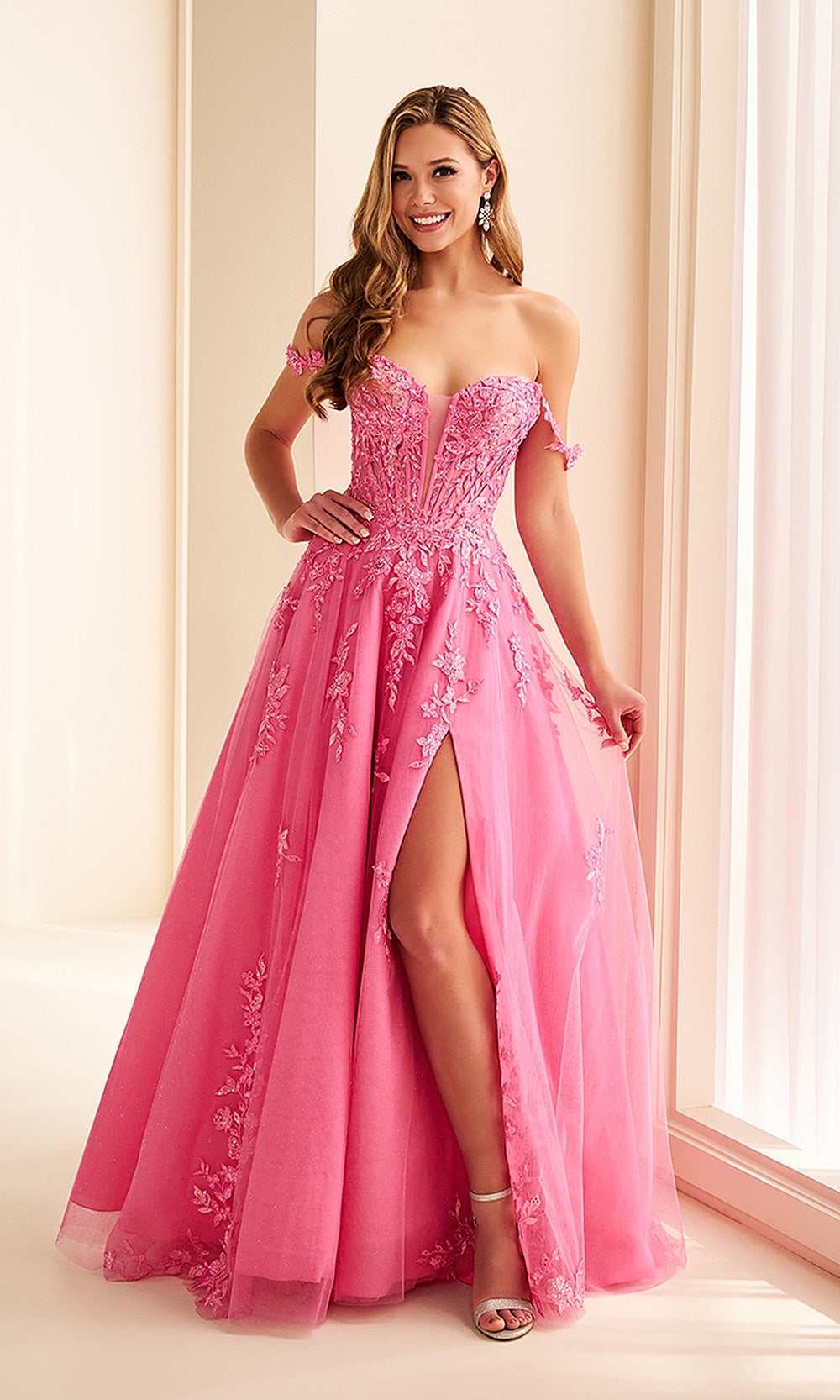 Ellie Wilde EW38205 Hot Pink prom dress front view with glitter tulle, floral appliques, off-shoulder illusion corset ballgown, formal prom gown.