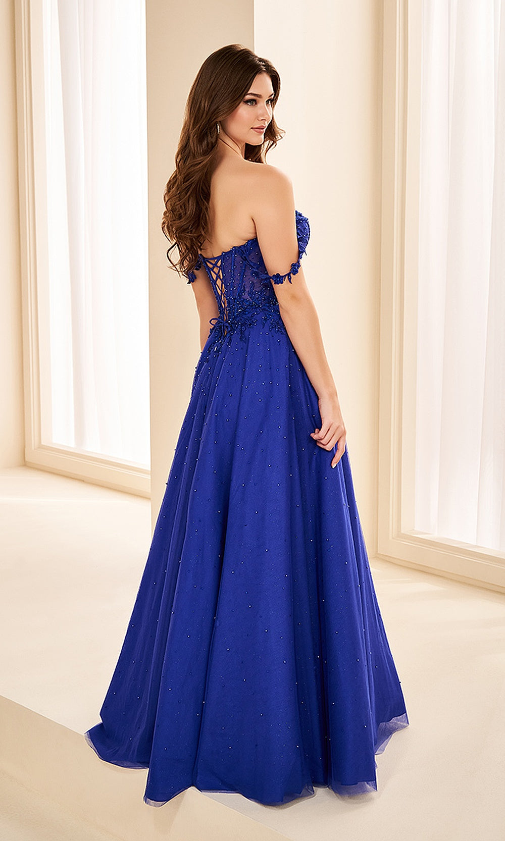 Ellie Wilde EW38210 Royal Blue prom dress back view with glitter tulle and lace, corset back with boning, off-shoulder a-line ballgown silhouette, evening gown.