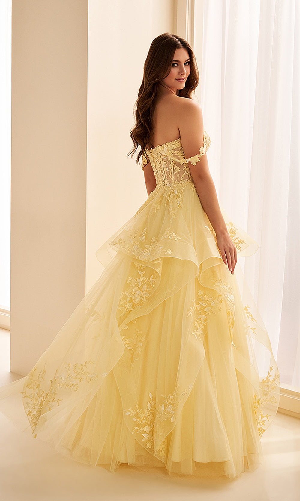Ellie Wilde EW38211 Light Yellow prom dress back view with glitter tulle, lace beading, corset back closure, ruffled ballgown skirt with train, evening gown.