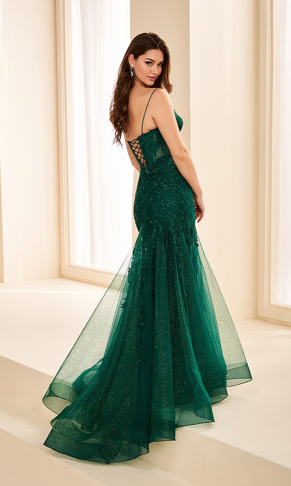 Ellie Wilde EW38213 Emerald prom dress back view with glitter tulle, crisscross open back, mermaid silhouette, and a sweeping train — an evening gown.