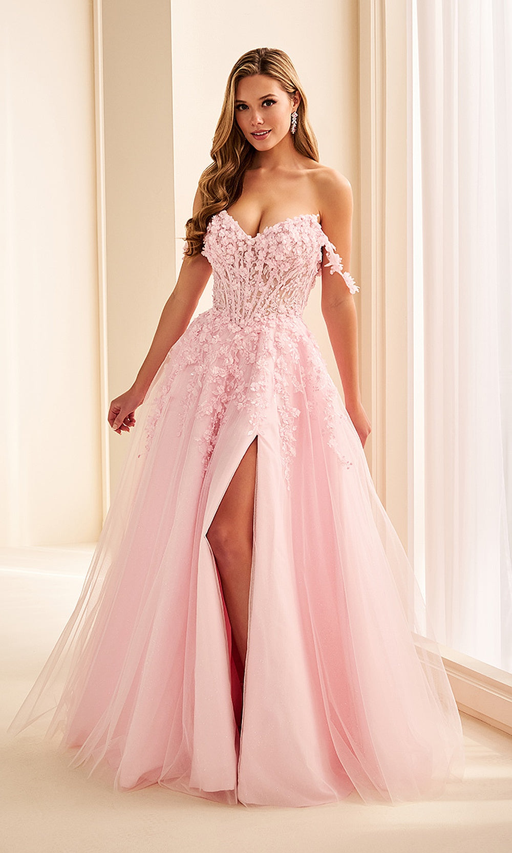 Ellie Wilde EW38224 Pink prom dress front view with glitter tulle, floral appliques, off-shoulder sweetheart corset ballgown, formal prom gown with train.
