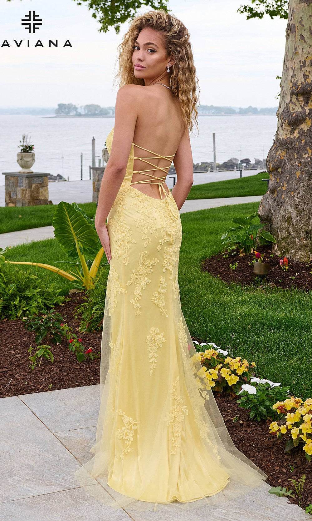 Faviana 11627 Light Yellow open back view with full lace-up crisscross straps spanning upper back, bare back exposed to waist, prom gown