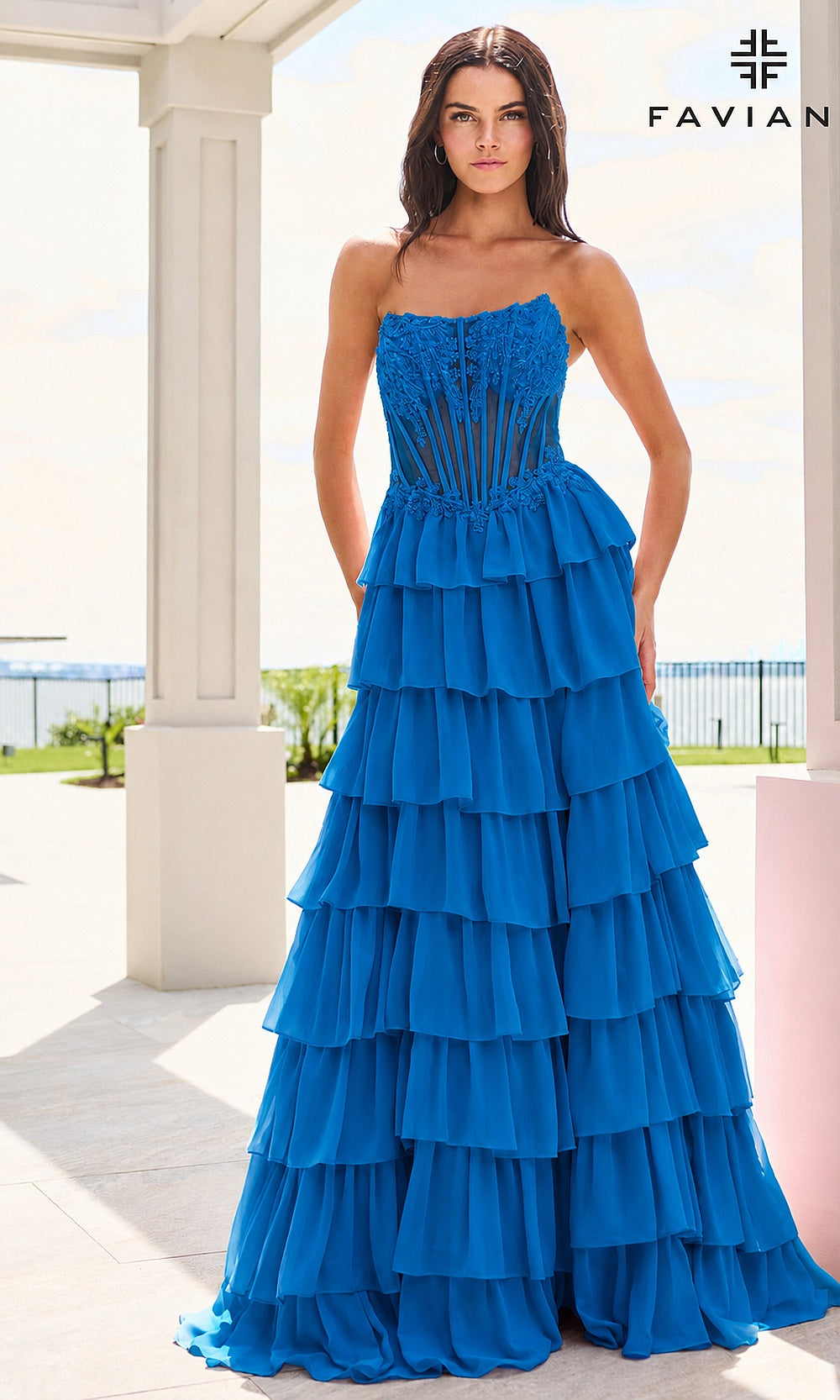 Faviana 11629 Ink Blue prom dress front view with corset lace-up back, sheer boned bodice, tiered chiffon ruffle skirt, a-line silhouette, formal prom gown
