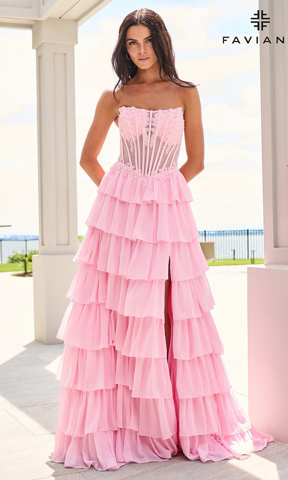 Faviana 11629 Light Pink prom dress front view with strapless scoop neckline, sheer boned corset bodice, lace floral appliqués at neckline, tiered chiffon ruffle skirt, evening gown