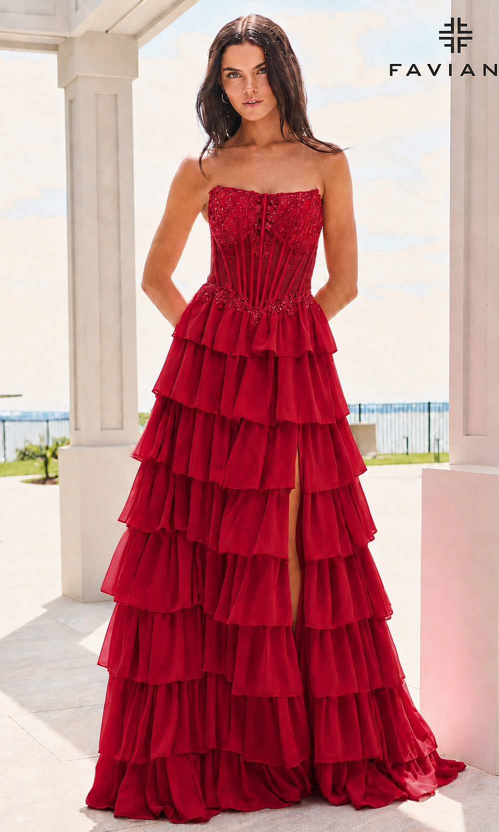 Faviana 11629 Red prom dress front view with strapless scoop neckline, sheer boned corset bodice, lace floral appliqués at neckline, tiered chiffon ruffle skirt, evening gown
