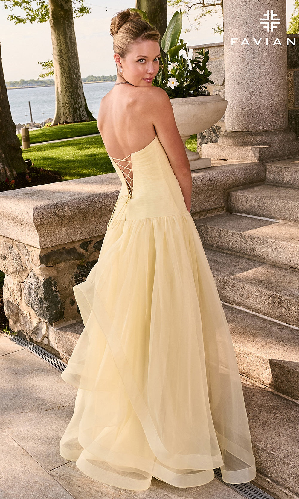 Faviana 11668 Butter Yellow prom A-line gown back view lace-up corset closure draped organza skirt long gown elegant floor-length silhouette photographed in boutique studio lighting