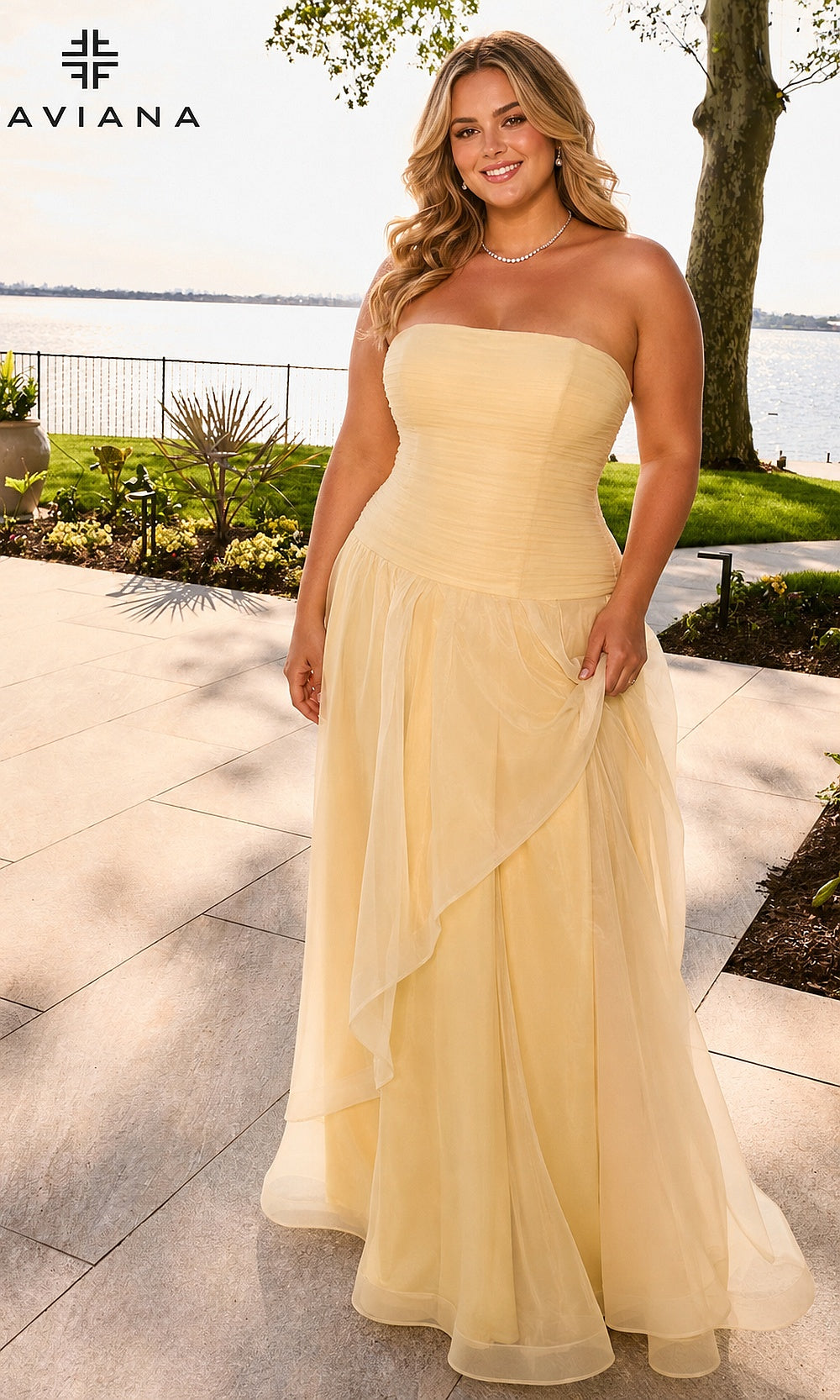 Faviana 11668E plus size prom gown front view in Butter Yellow, strapless boned corset bodice with dropped waist and draped organza A-line skirt