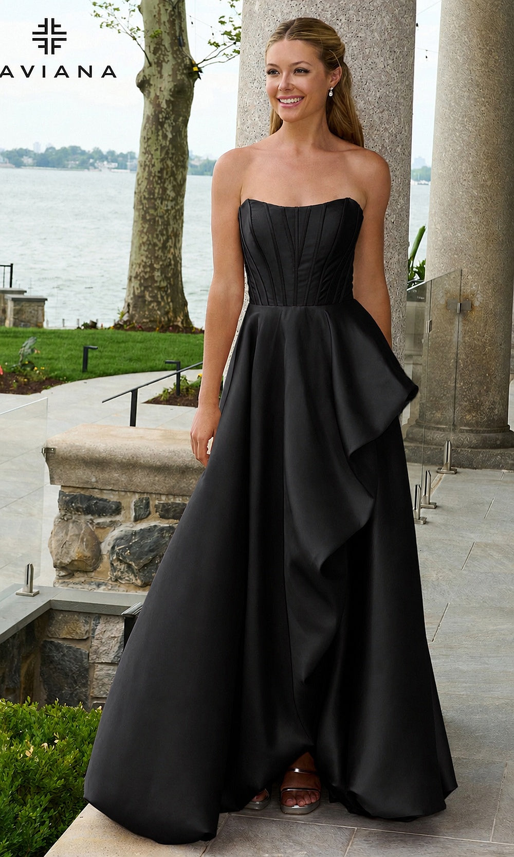 Faviana E11671 Black prom dress front view, sleek black strapless satin corset ballgown with draped side panel and pockets, evening gown