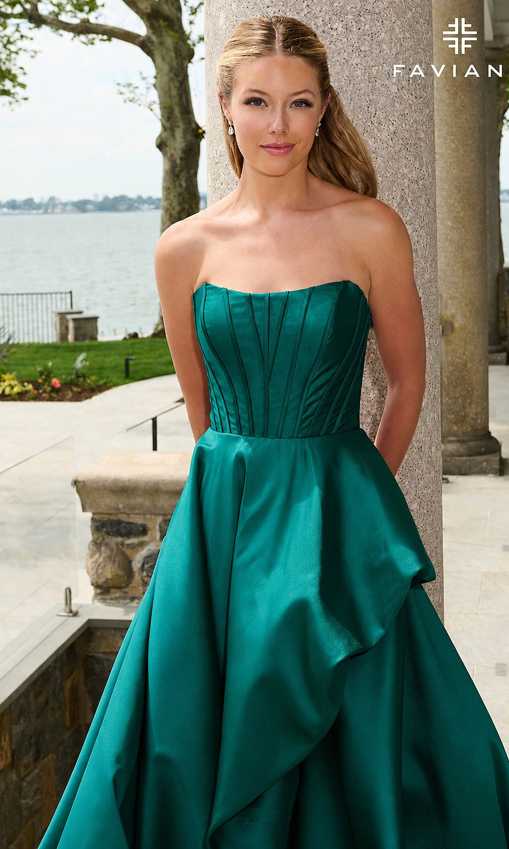Faviana E11671 Dark Emerald prom dress detail view of boned corset bodice and draped satin panel in deep green, debut ball gown