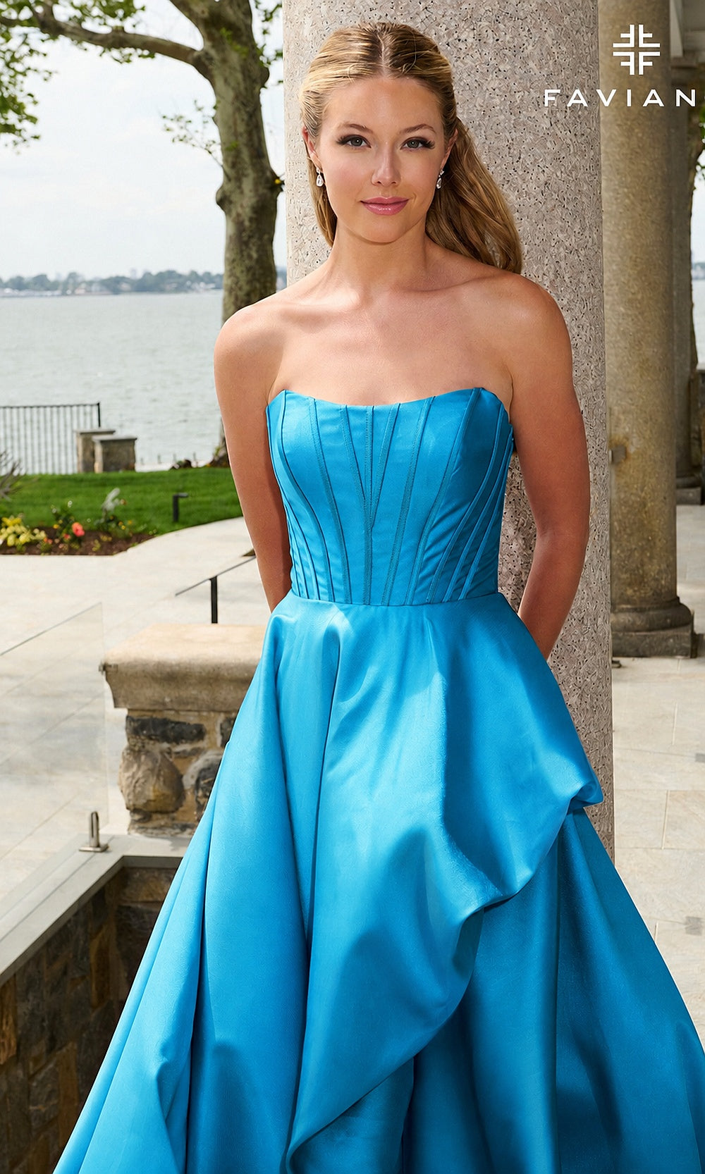 Faviana E11671 Ocean Blue prom dress detail view of strapless corset bodice and sculptural satin drape in vivid blue, formal prom gown