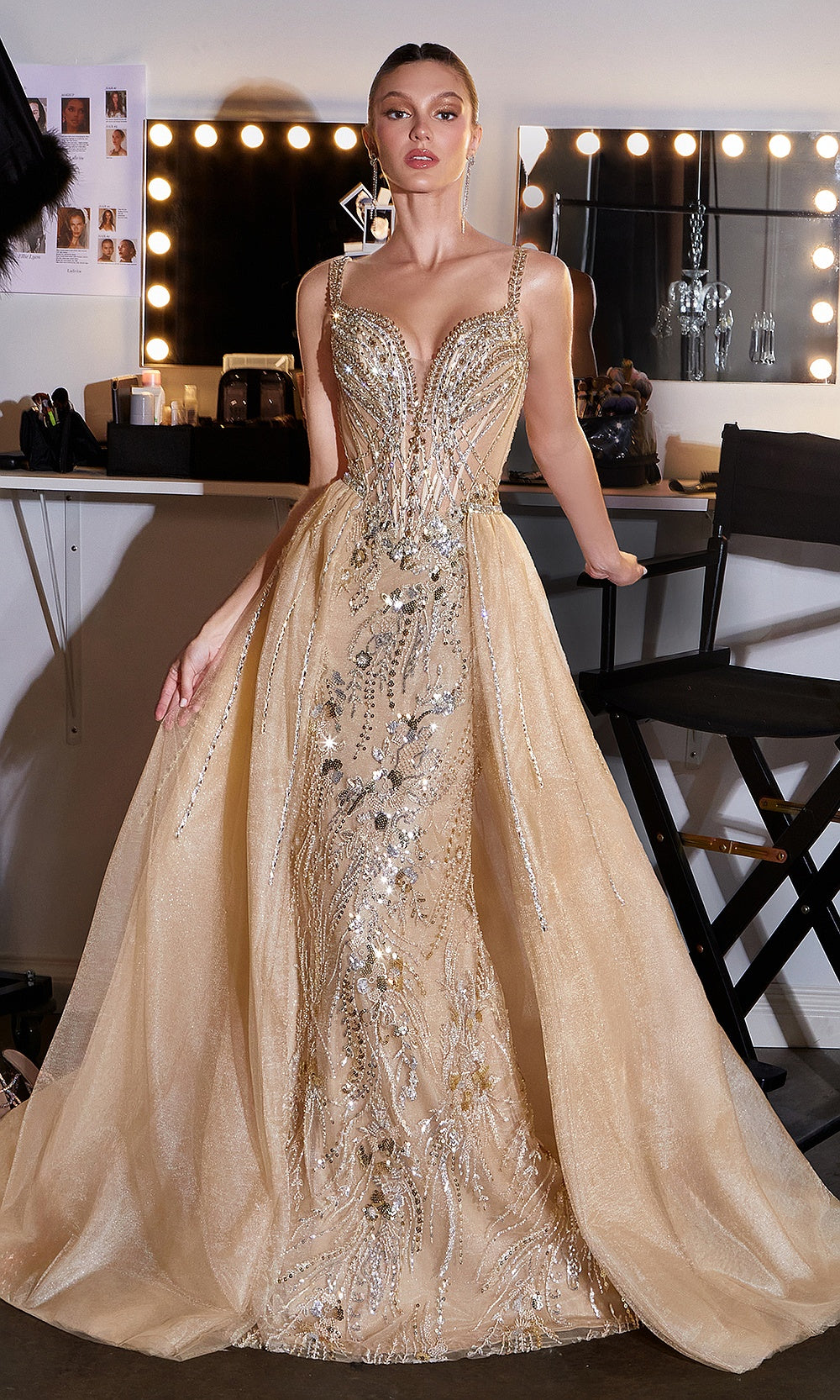 Ladivine CDS570 Gold prom dress standing editorial full front, overskirt open ballgown presentation, beaded straps, sweetheart neckline, fully beaded underdress, pageant gown