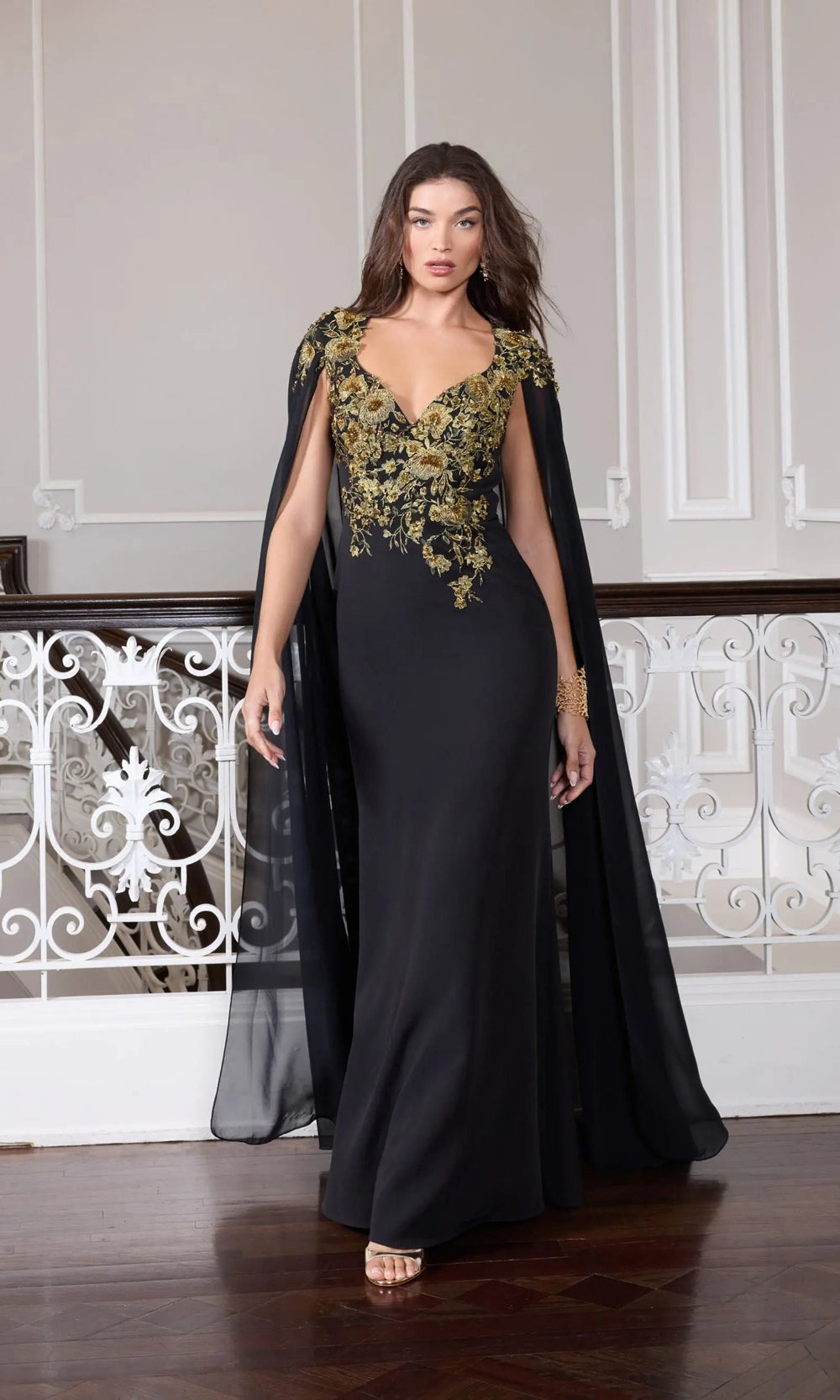 Mac Duggal 13206 black-gold editorial front formal gown with stretch jersey base, gold floral beaded bodice, floor-length chiffon cape, black-tie event dress