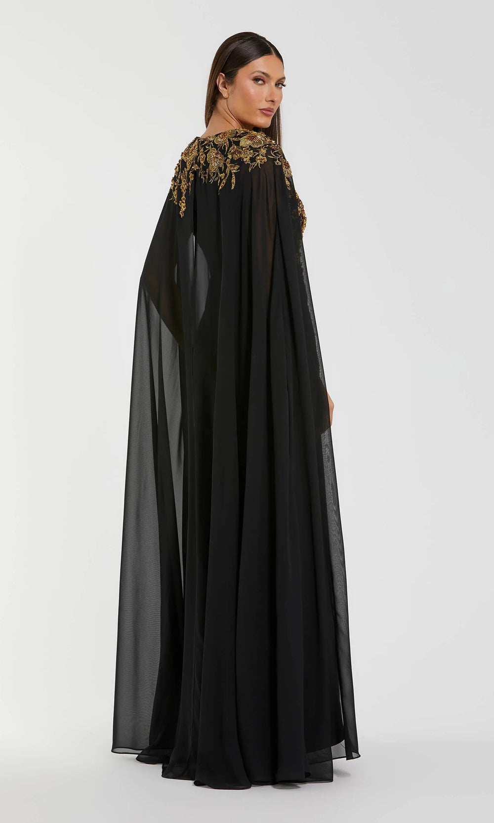 Mac Duggal 13206 black-gold back view formal gown with attached chiffon cape draping to floor, high back coverage, fitted jersey skirt, gala gown
