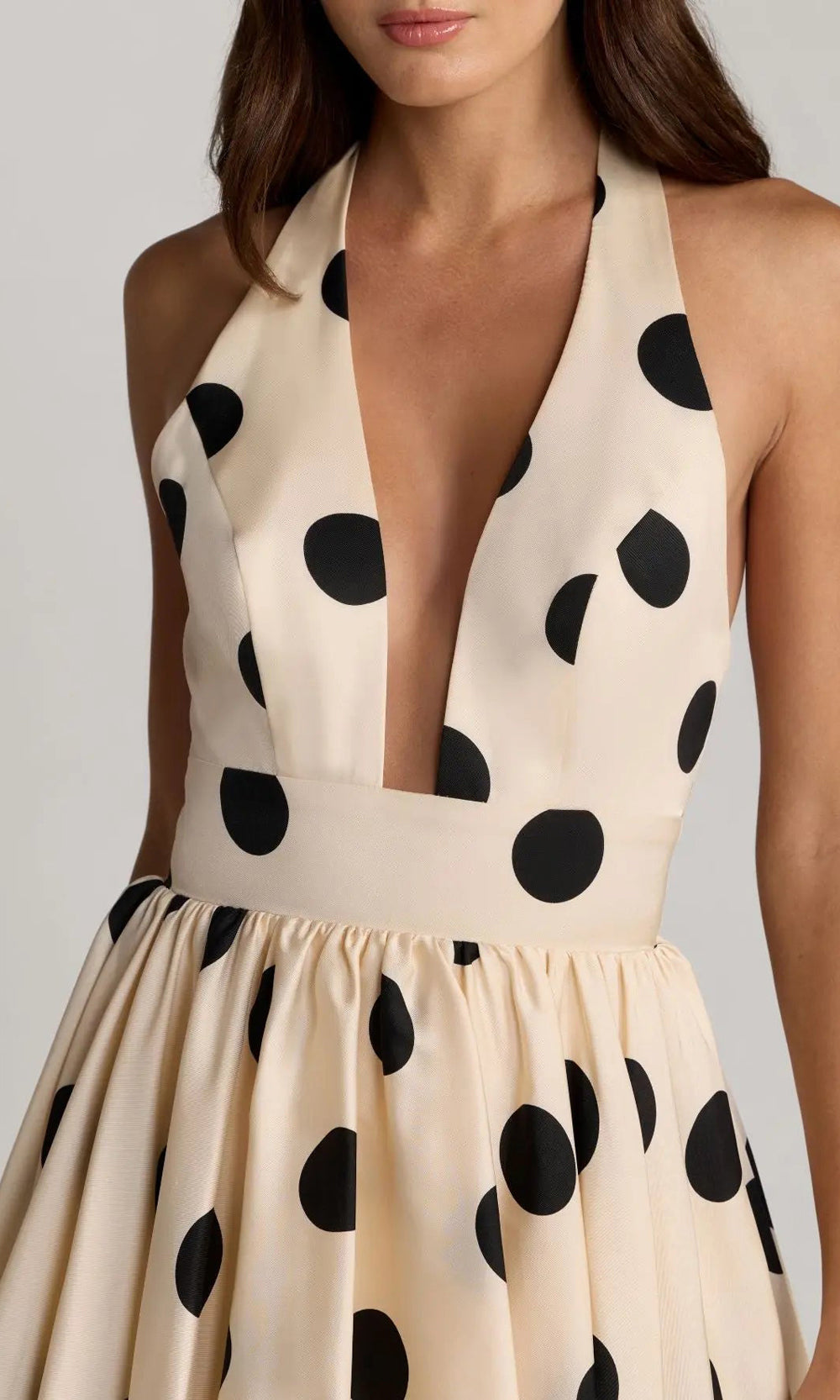 Mac Duggal 27833 Black Ivory prom gown detail view of polka-dot satin fabric and stacked tiered ruffle flounce layers, formal prom gown construction