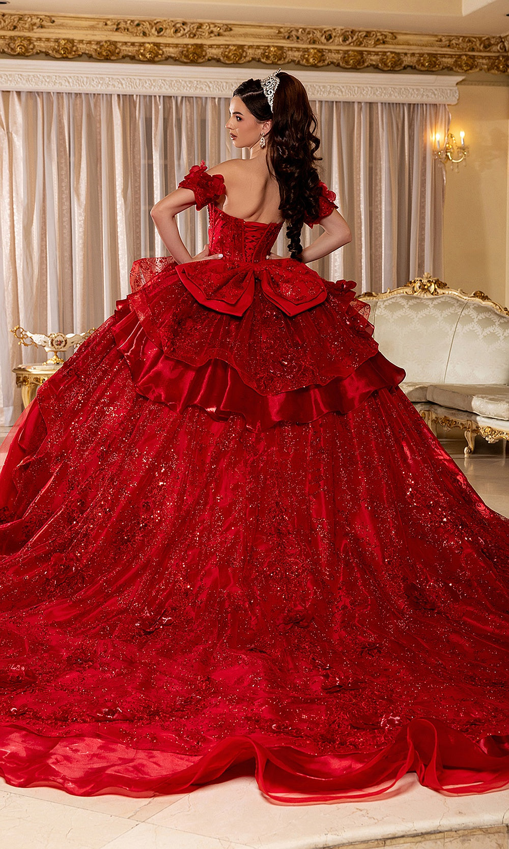 May Queen LK295 red ball gown — angled back view of the beaded corset back and layered ruffle train