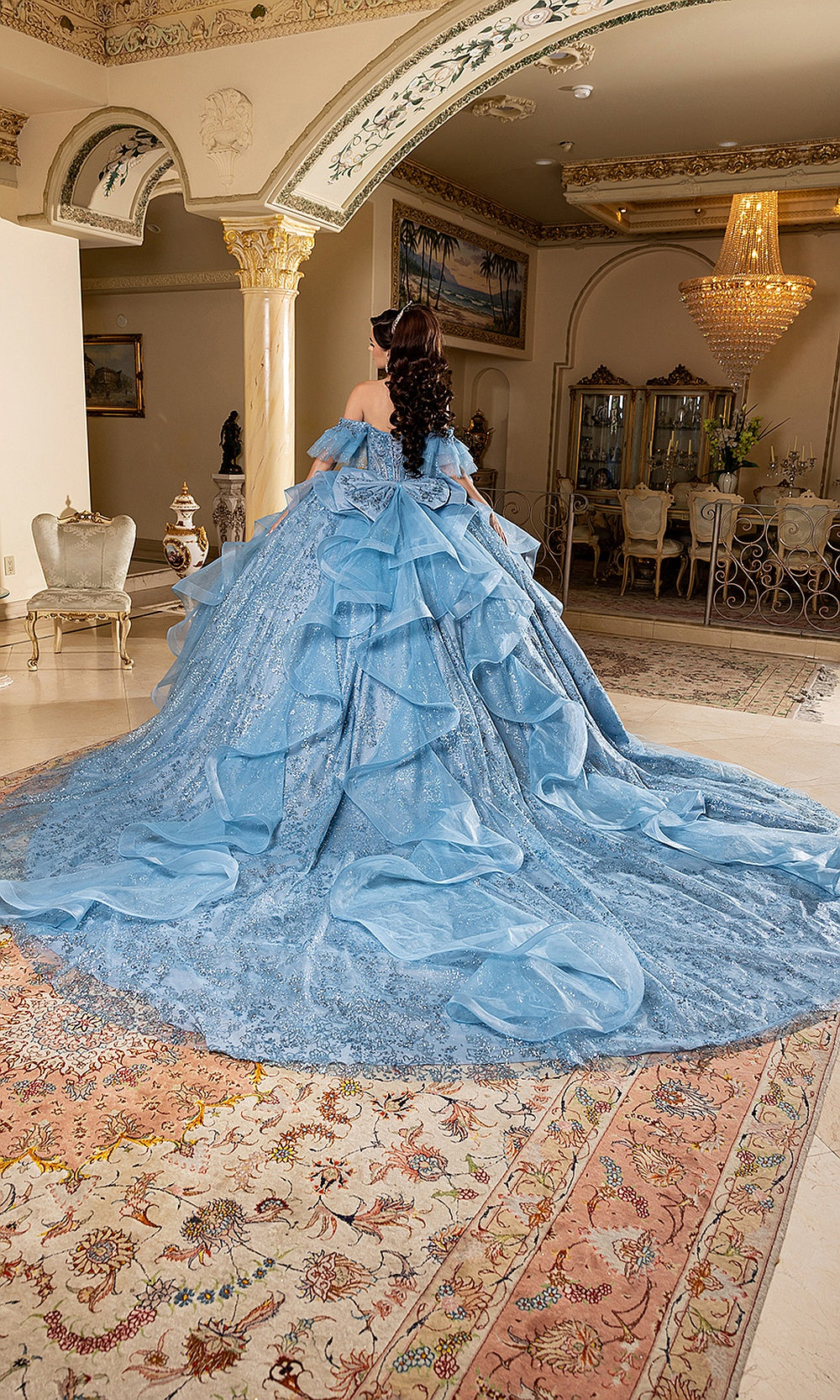 May Queen LK296 blue quinceañera ball gown — back view of the tiered ruffle skirt and long train