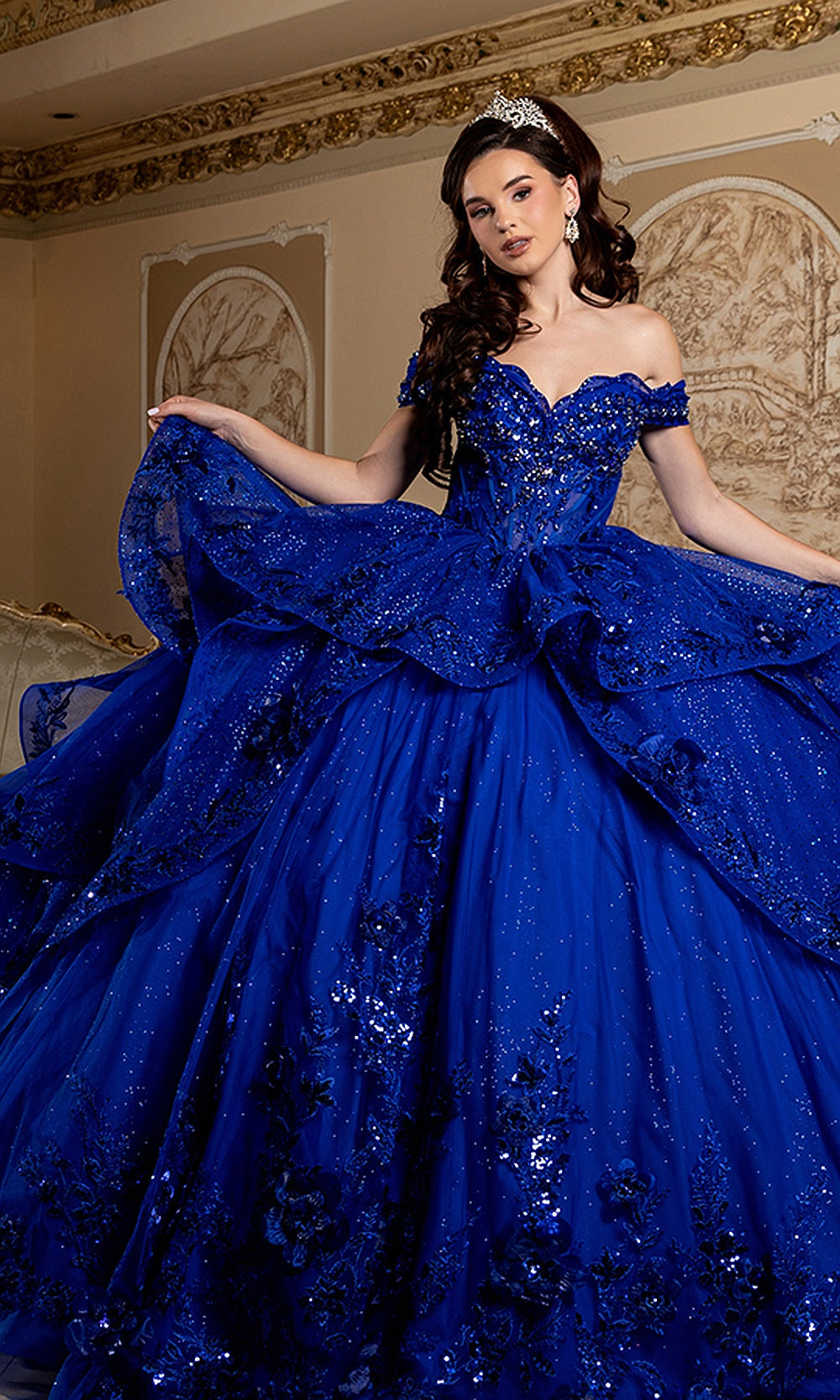 May Queen LK298 royal blue quinceañera gown — side view of the draped overskirt and full glitter skirt