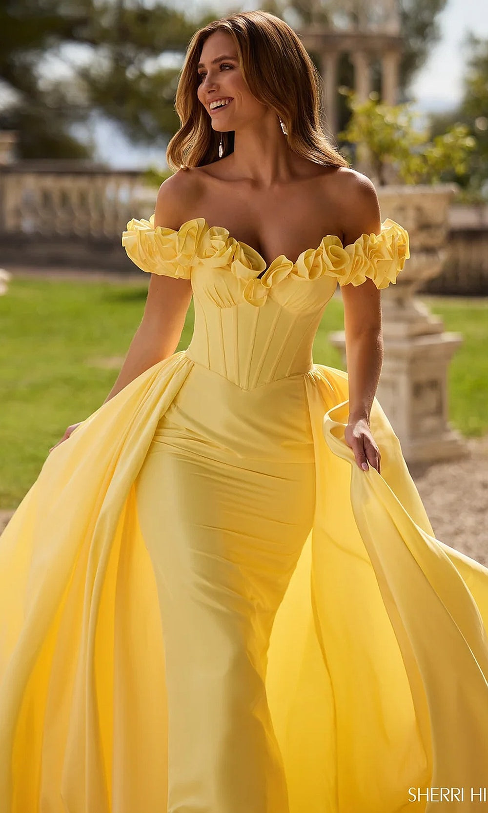 Sherri Hill 57200 Yellow prom gown detail view showing 3D floral appliqué off-shoulder trim, sweetheart neckline boning channels, pageant gown embellishment