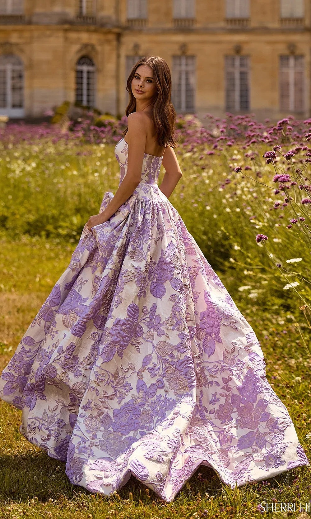 Sherri Hill 57730 Ivory Lilac strapless floral jacquard ballgown prom dress with structured full skirt and train, side view, evening gown