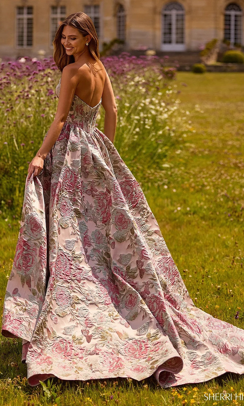 Sherri Hill 57757 Pink Multi floral jacquard prom ballgown back view showing fully open back, cathedral train, a-line skirt, evening gown red carpet styling