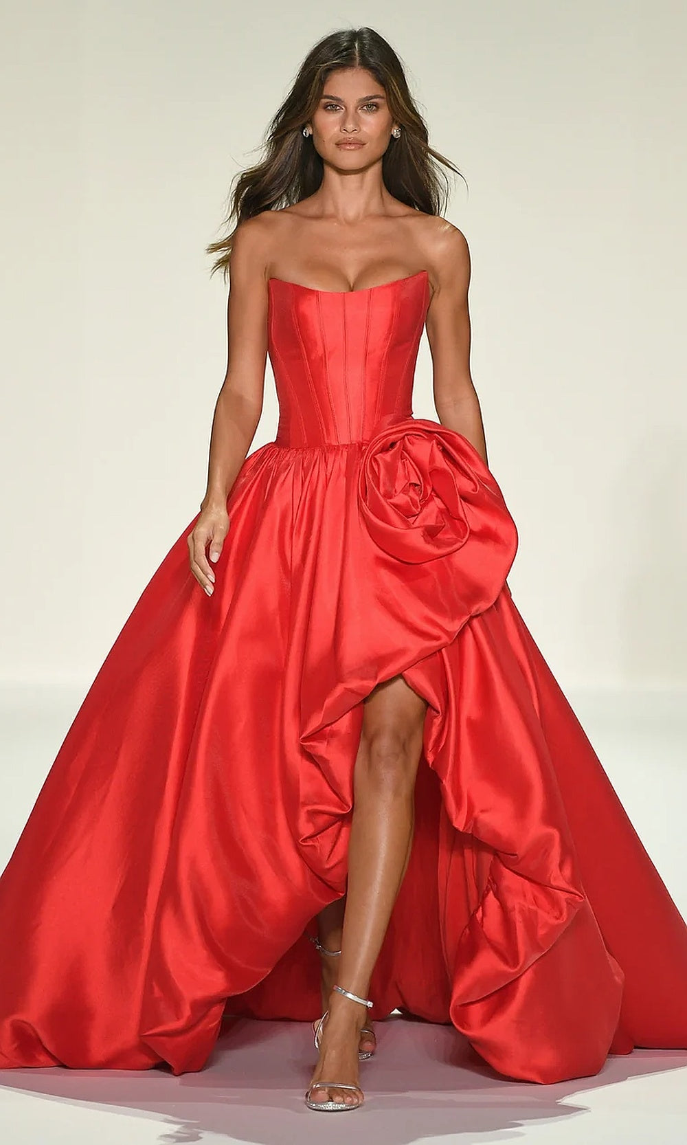 Sherri Hill 57778 Red prom dress editorial view strapless ballgown with front high slit cathedral train and dimensional rose appliqué red carpet styling