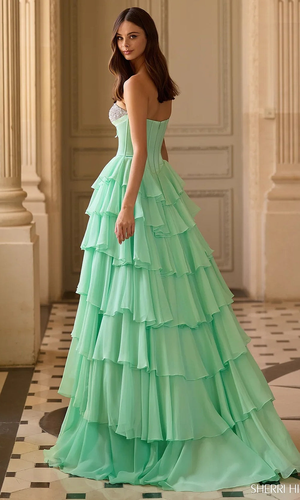 Sherri Hill 57799 Light Green prom dress back view with open back, lacing closure hardware, voluminous tiered chiffon skirt, evening gown