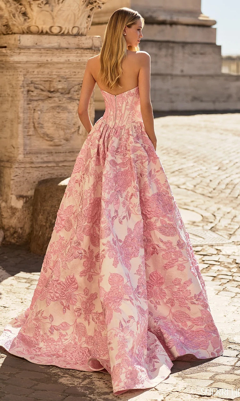 Sherri Hill 57912 Pink prom gown back view showing lace-up corset back, full ballgown skirt, sweep train, evening gown