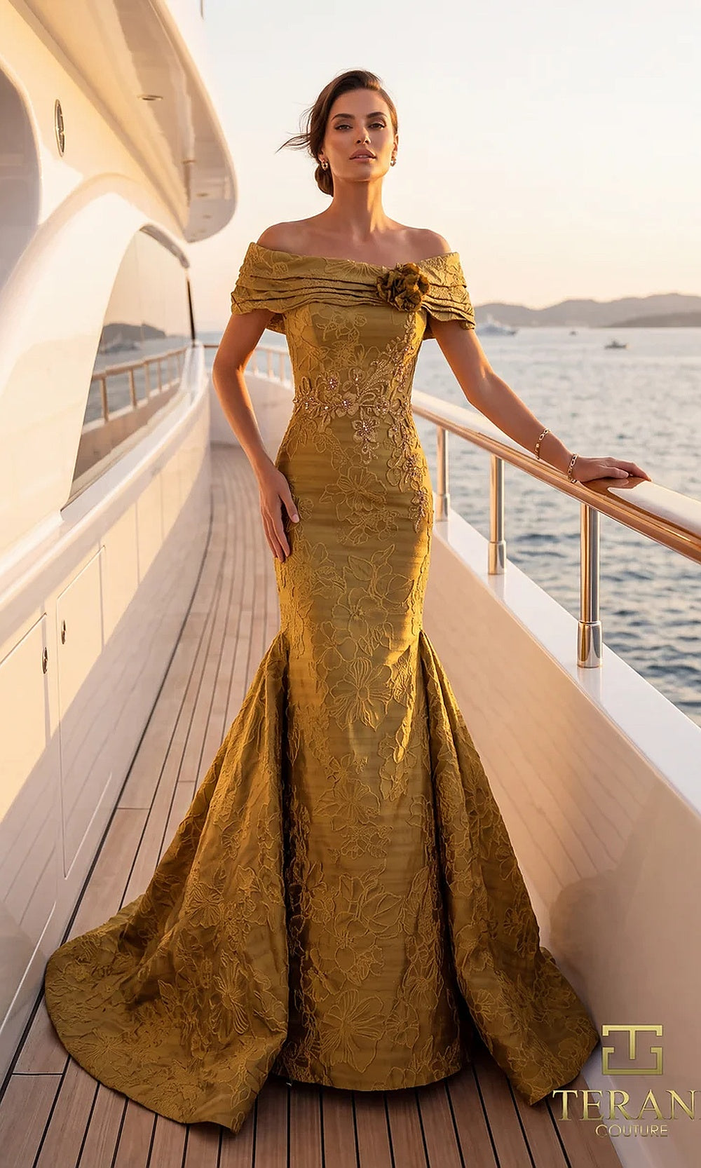 Terani Couture 262E7069 Gold formal evening dress front view with off-shoulder ruched neckline with rosette, textured metallic jacquard fitted mermaid, black tie event dress