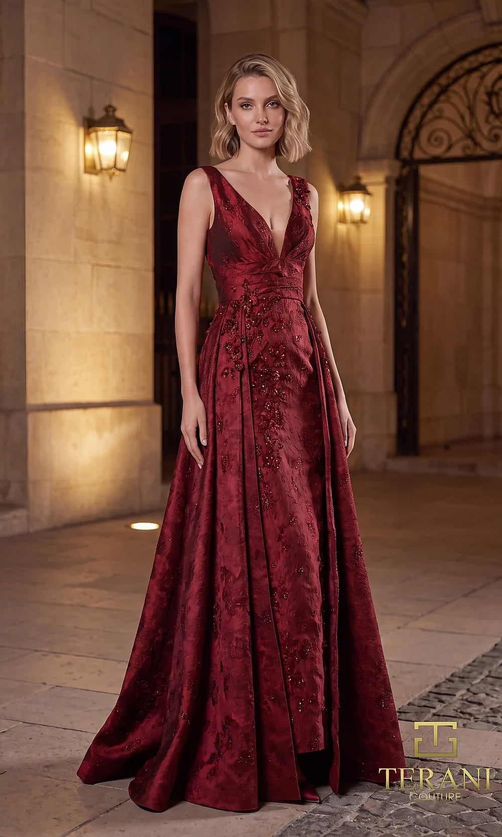 Terani Couture 262E7138 Merlot formal evening dress front view with plunging V-neck sleeveless jacquard bodice with beaded appliqué, A-line with overskirt, black tie event dress
