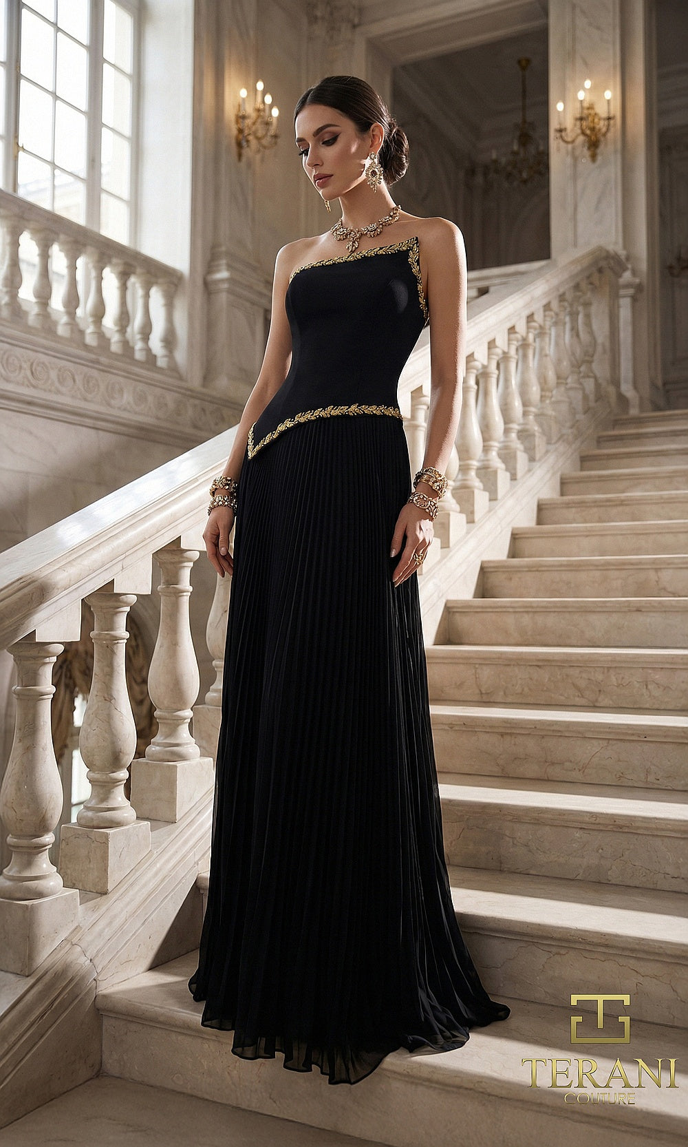 Terani Couture 262E7352 Black formal evening dress front view with strapless asymmetric neckline with gold beaded trim, beaded drop waist, pleated chiffon A-line, black tie event dress