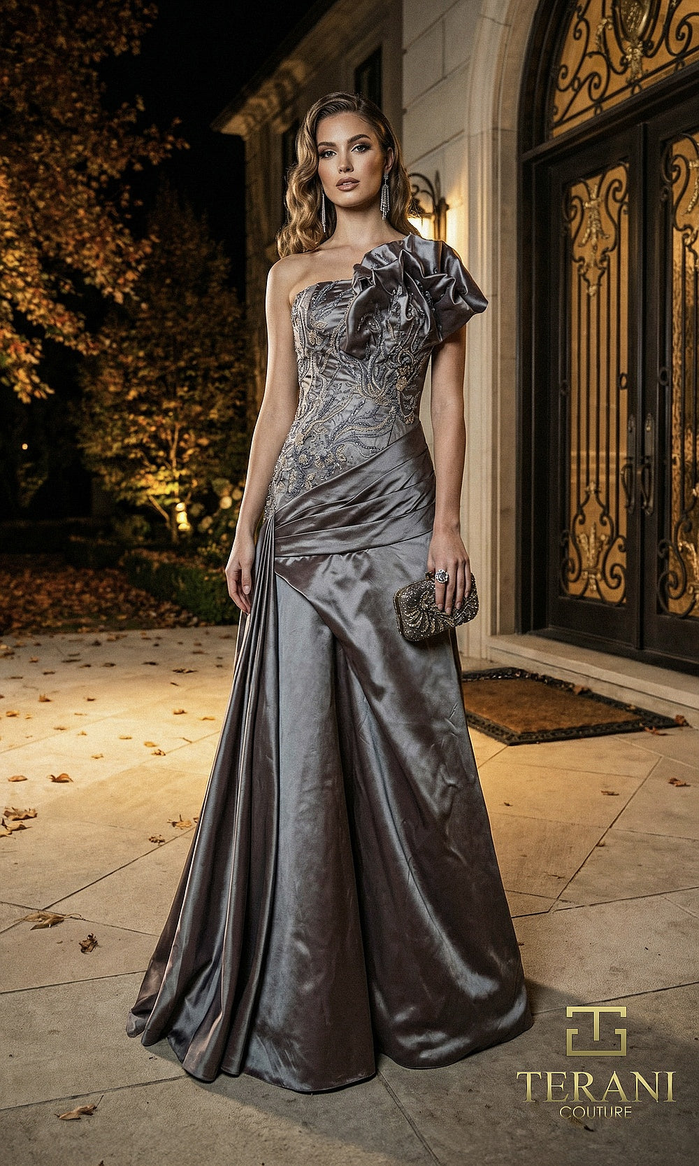 Terani Couture 262E7530 Slate Blue formal evening dress front view with one-shoulder ruffle, beaded lace bodice, draped metallic satin gown with overskirt, black tie event dress
