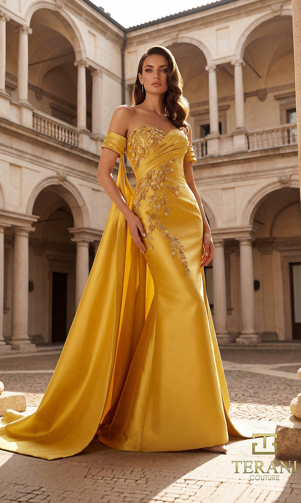 Terani Couture 262M7252 Gold mother of the bride dress front view with off-shoulder sweetheart, beaded lace appliqué on satin, column with dramatic back cape overlay, mother of the bride styling