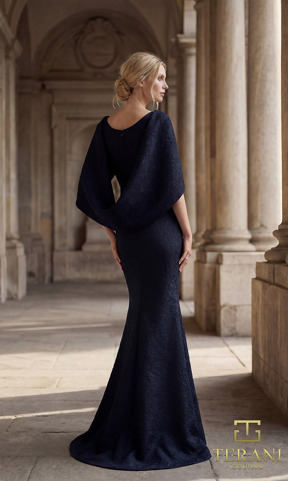 Terani Couture 262M7262 Navy mother of the bride dress back view with scoop neckline cape-sleeve, textured jacquard mermaid, formal wedding celebration dress