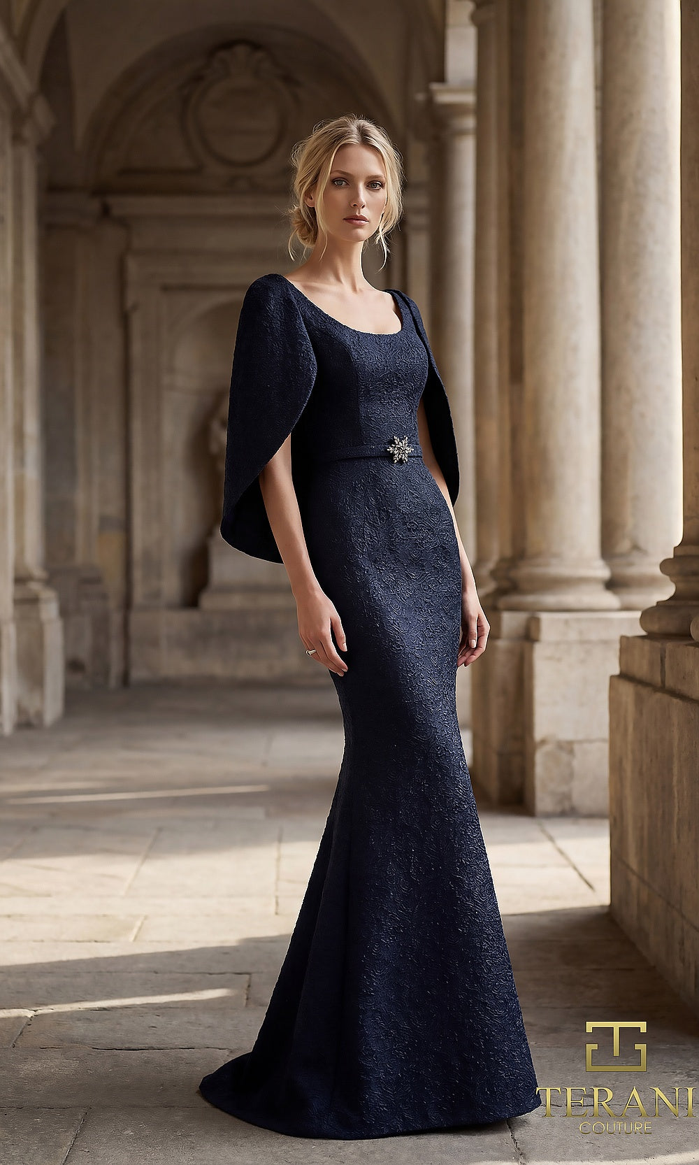 Terani Couture 262M7262 Navy mother of the bride dress front view with scoop neckline with sheer cape sleeves, textured jacquard fitted mermaid with brooch belt, mother of the bride styling