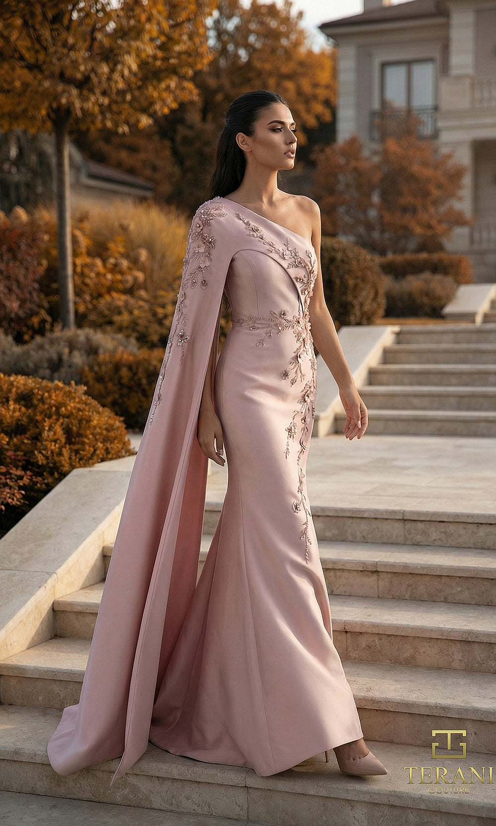 Terani Couture 262M7275 Dark Blush mother of the bride dress front view with one-shoulder crepe fitted mermaid with floor-length cape sleeve and beaded appliqué, mother of the bride styling