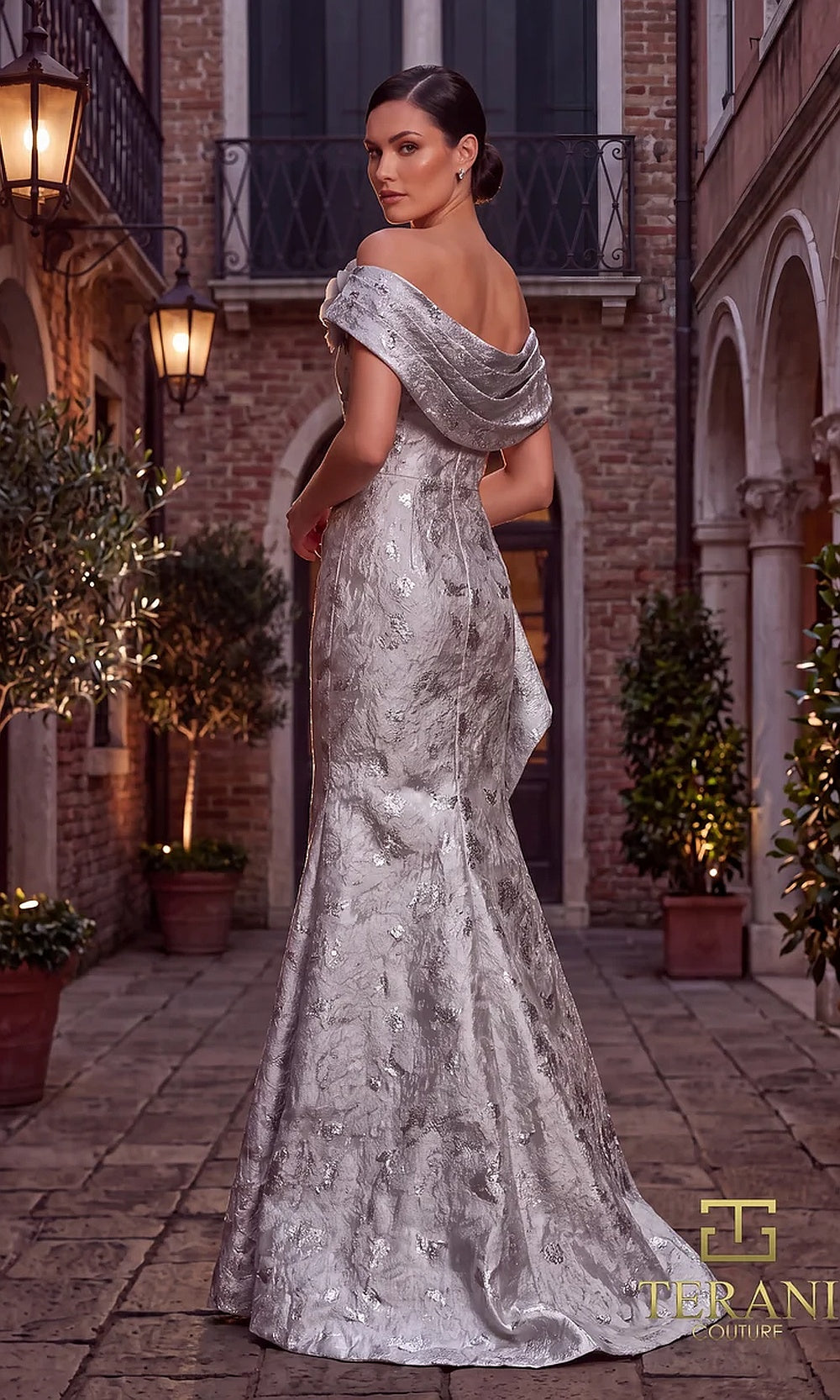 Terani Couture 262M7298 Silver mother of the bride dress back view with off-shoulder folded neckline, metallic brocade mermaid with back drape, formal wedding celebration dress