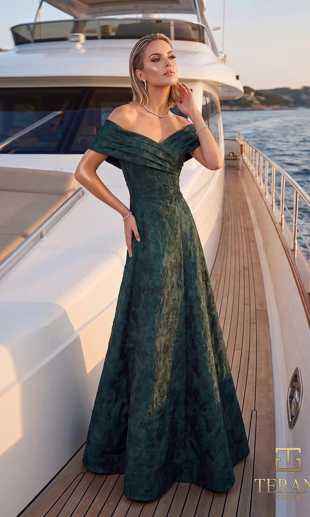 Terani Couture 262M7299 Evergreen mother of the bride dress front view with off-shoulder folded portrait neckline, textured jacquard full A-line gown, mother of the bride styling
