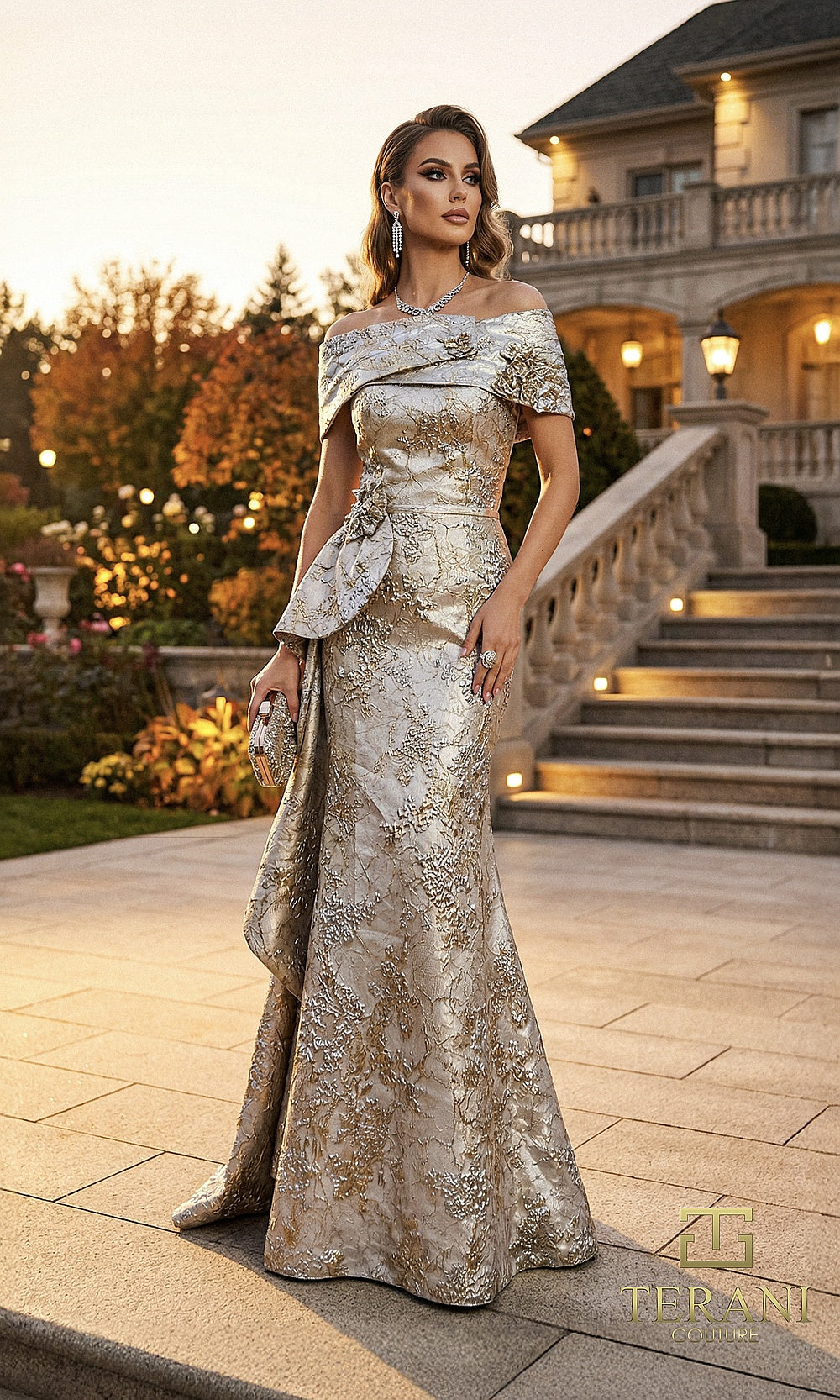 Terani Couture 262M7303 Champagne mother of the bride dress front view with off-shoulder folded neckline, metallic brocade fitted mermaid with sculpted side peplum cascade, mother of the bride styling