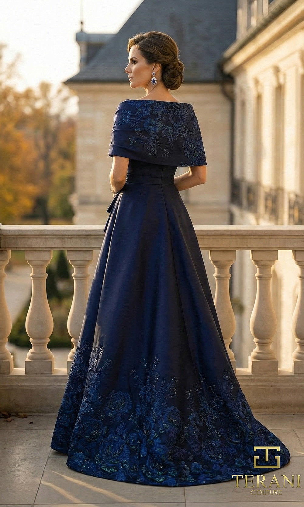 Terani Couture 262M7323 Navy mother of the bride dress back view with short-sleeve beaded bodice, satin A-line with embroidered hem and train, formal wedding celebration dress