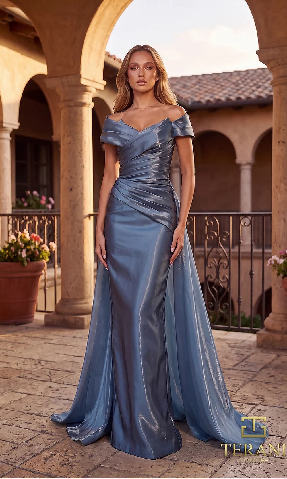 Terani Couture 262M7326 Slate mother of the bride dress front view with off-shoulder ruched sweetheart, metallic satin fitted column with draped overskirt, mother of the bride styling