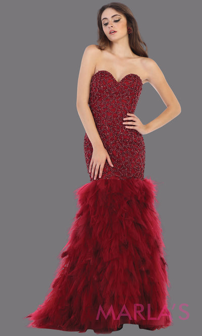 Long strapless burgundy mermaid evening gown with feathers from MayQueen RQ7668. This dark red gown is perfect for prom, wedding reception, engagement dress, e-shoot, prom, formal wedding guest dress, indowestern party dress, plus size